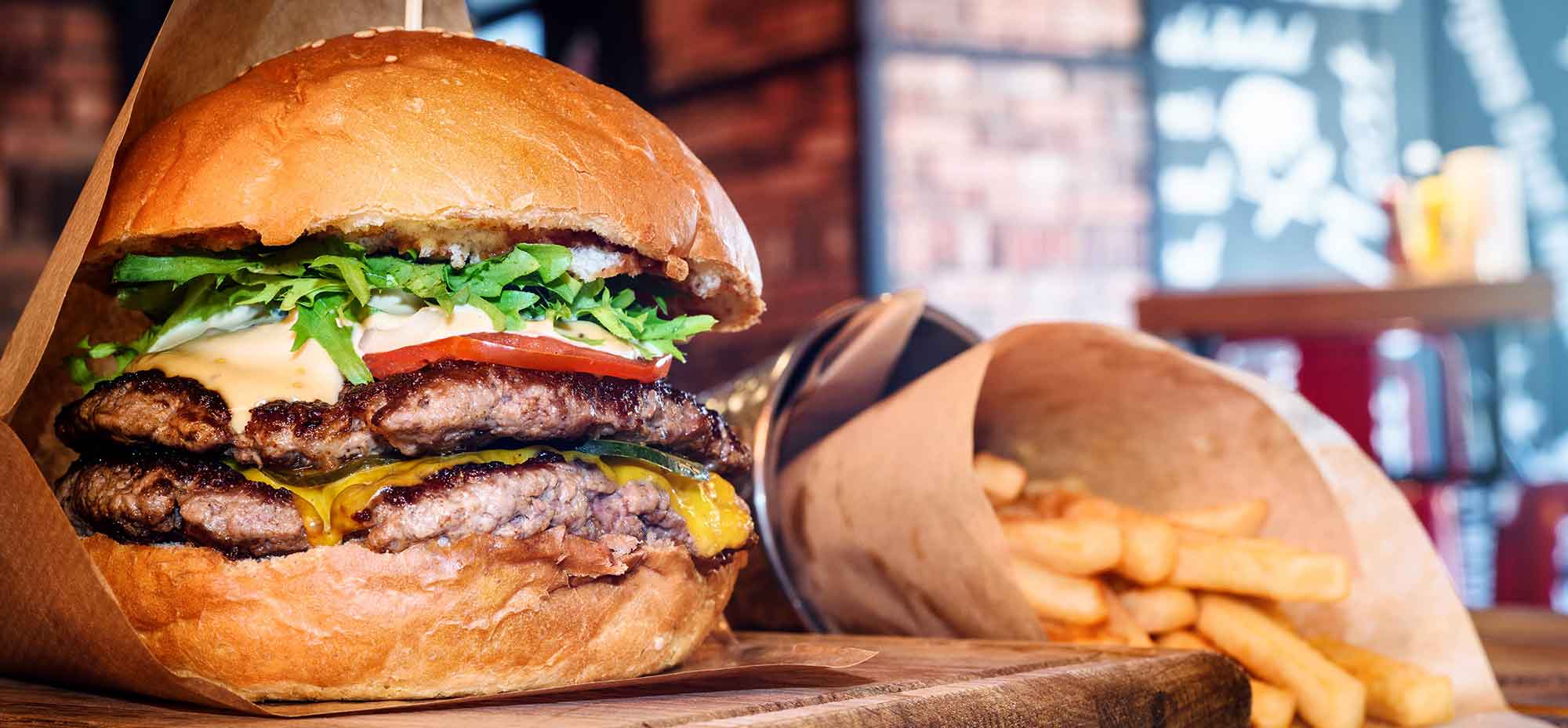 A picture of a burger and chips